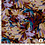 Viscose met gestyleerde bloemenprint in rood en bruintinten
