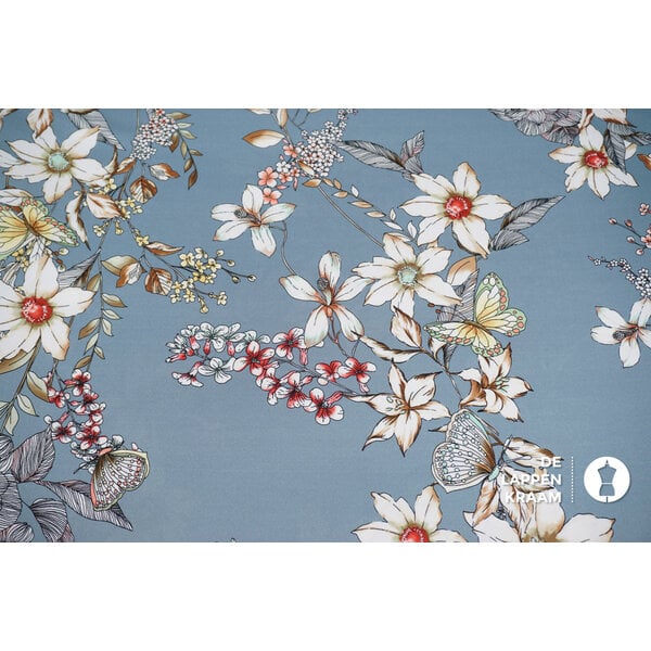 Dikke satijn lichtblauw met bloemenprint