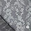 Polyester jacquard met glansdraad zilvergrijs