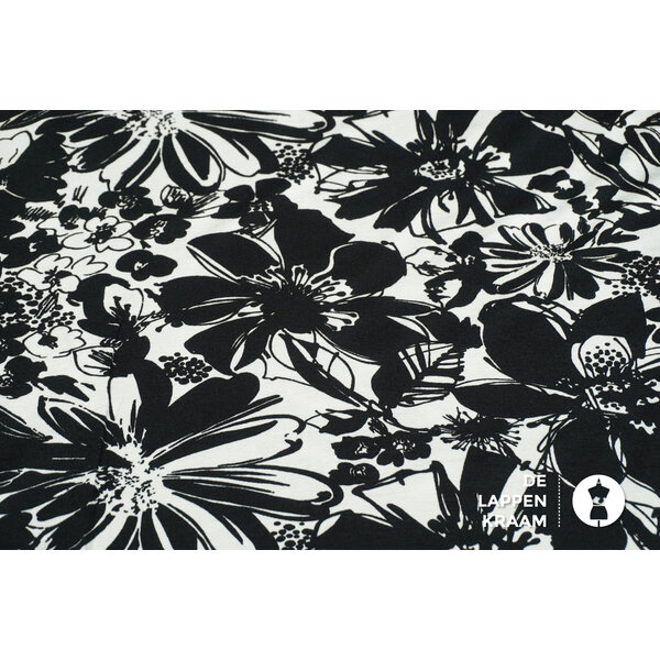 SALE Katoenen tricot stof in zwart-wit bloemenpatroon en enkelzijdige rand