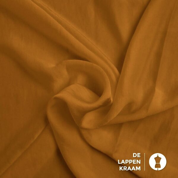 Wavy satin stof goud