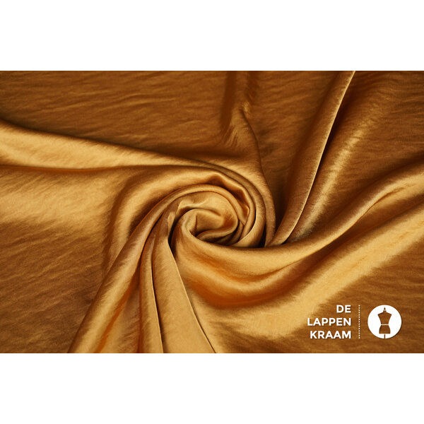 Wavy satin stof goud