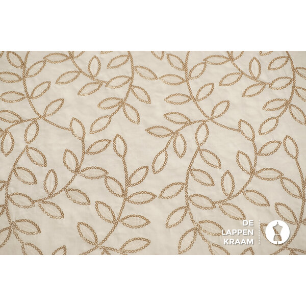 Katoenen voile stof ecru met goud borduursel in bladvormen