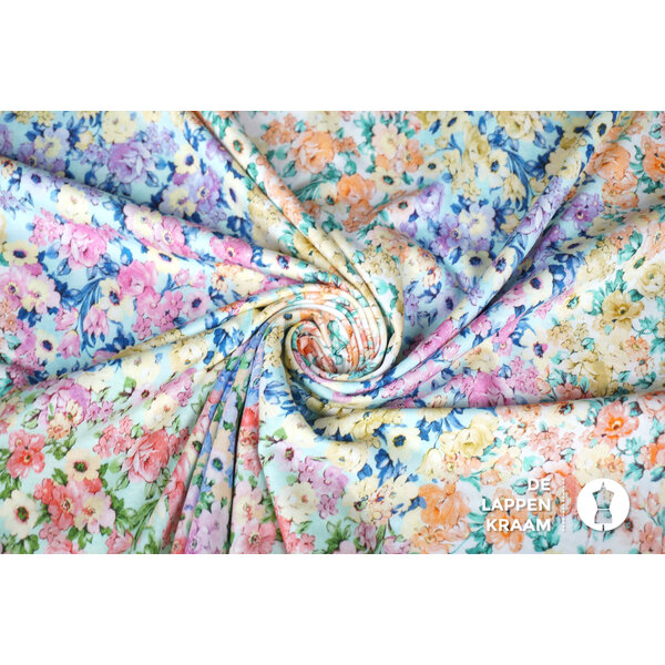 Tricot stof met kleurrijk bloemdessin