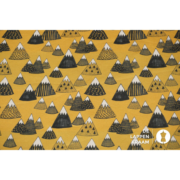 Tricot stof geel met abstracte bergen