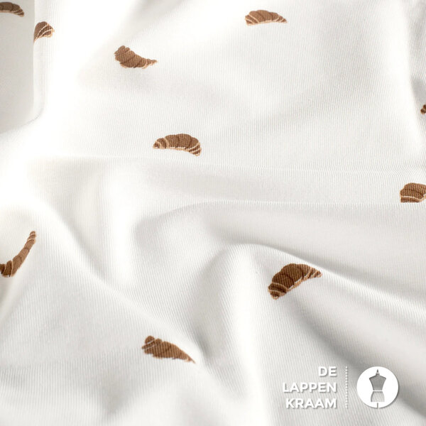 Tricot stof off white met croissantjes