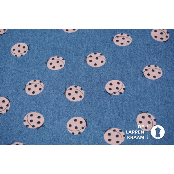 Denim stof met lieveheersbeestjes