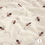 Terry crepe stof off white met bijtjes