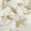 Mousseline Stof Off-White met Beige Sterren
