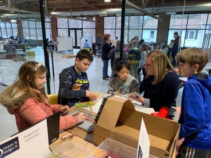 School kids working together on a STEM project