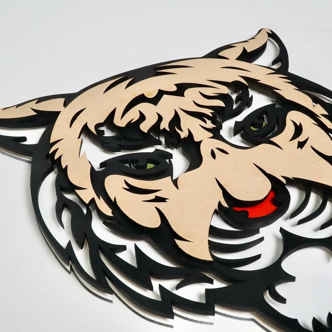 A tiger's head made with a FLUX laser cutter