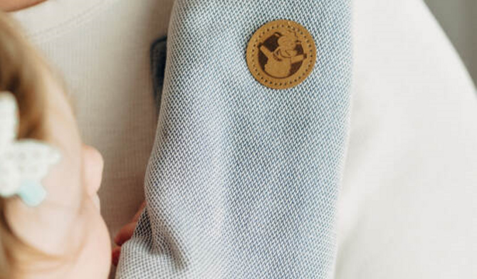 Welke teethingpads of droolpads passen op mijn draagzak? 