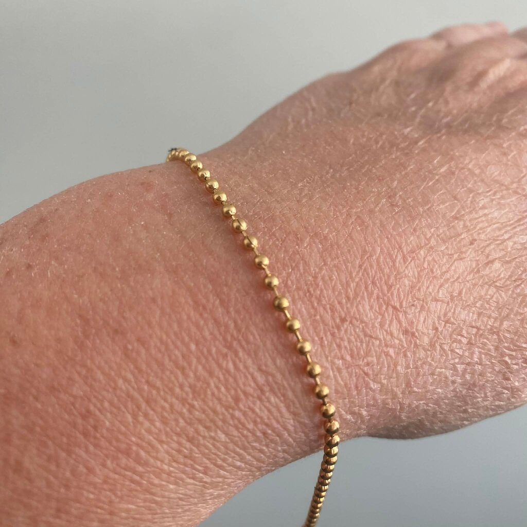 geen merk Armbandje - goudkleurig - bolletjes