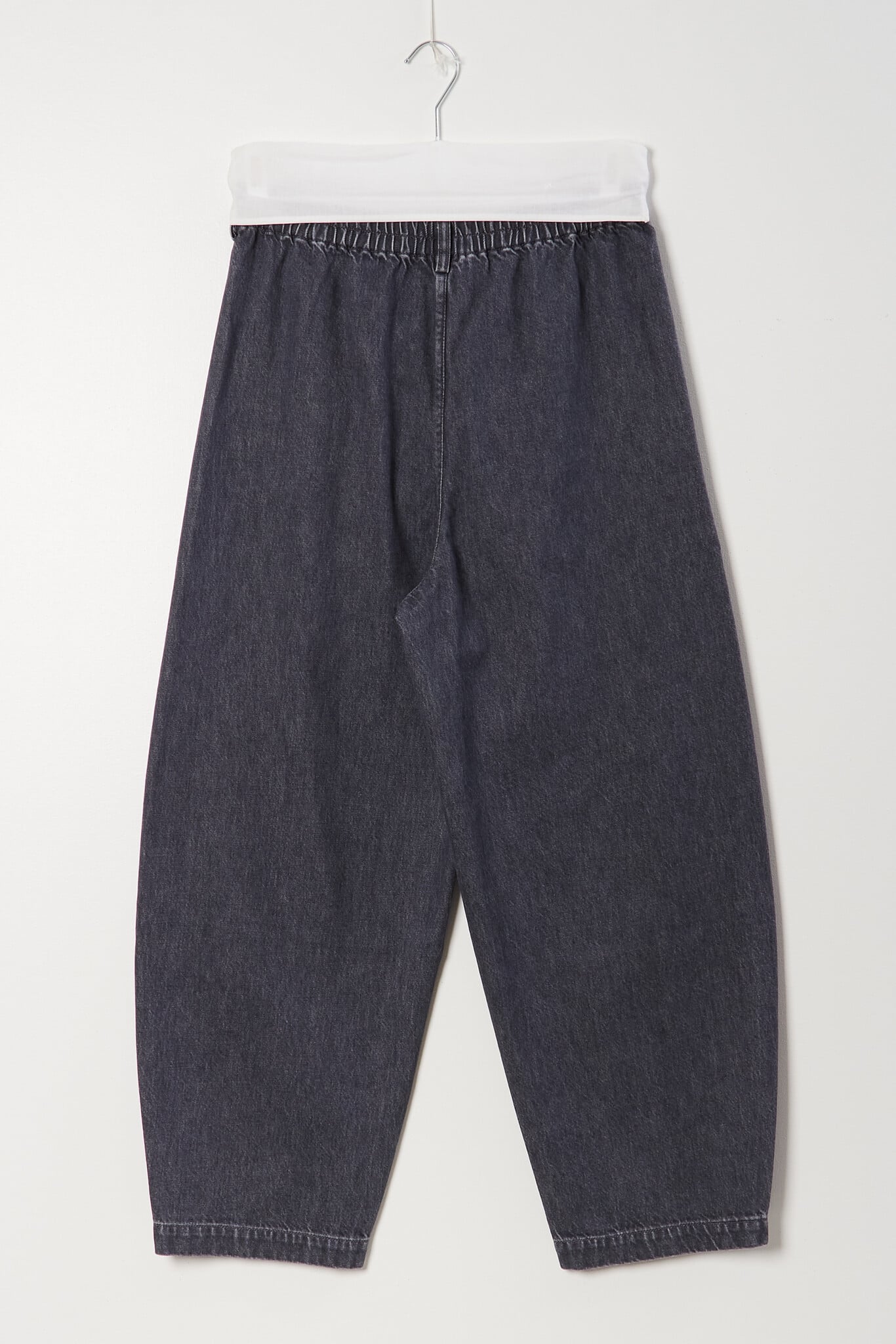 Cordera - Washed denim curved pants