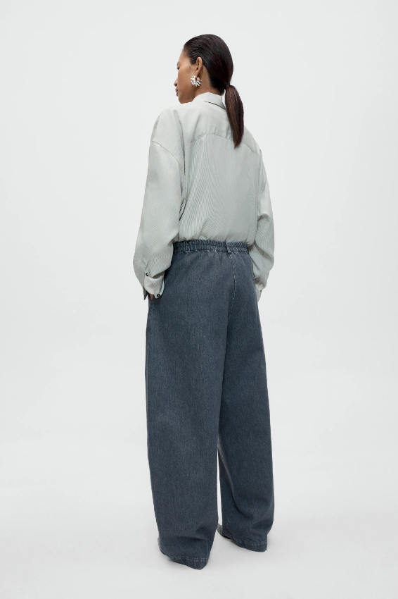 Cordera - Washed denim curved pants