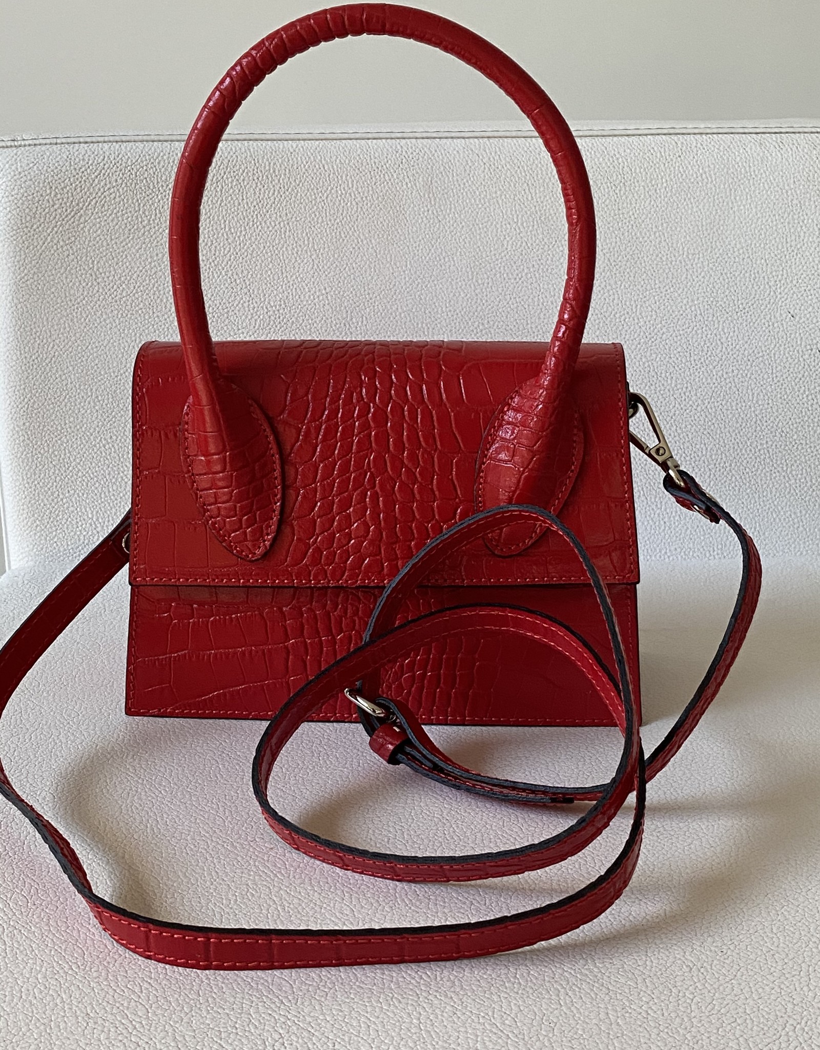 Giuliano Classy little handbag in crocoleather with fix handle and with long shoulderbelt.
