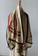 Long scarf with C logo in beige, red, green and black.