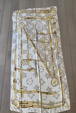 Long scarf with logo in beige colors.