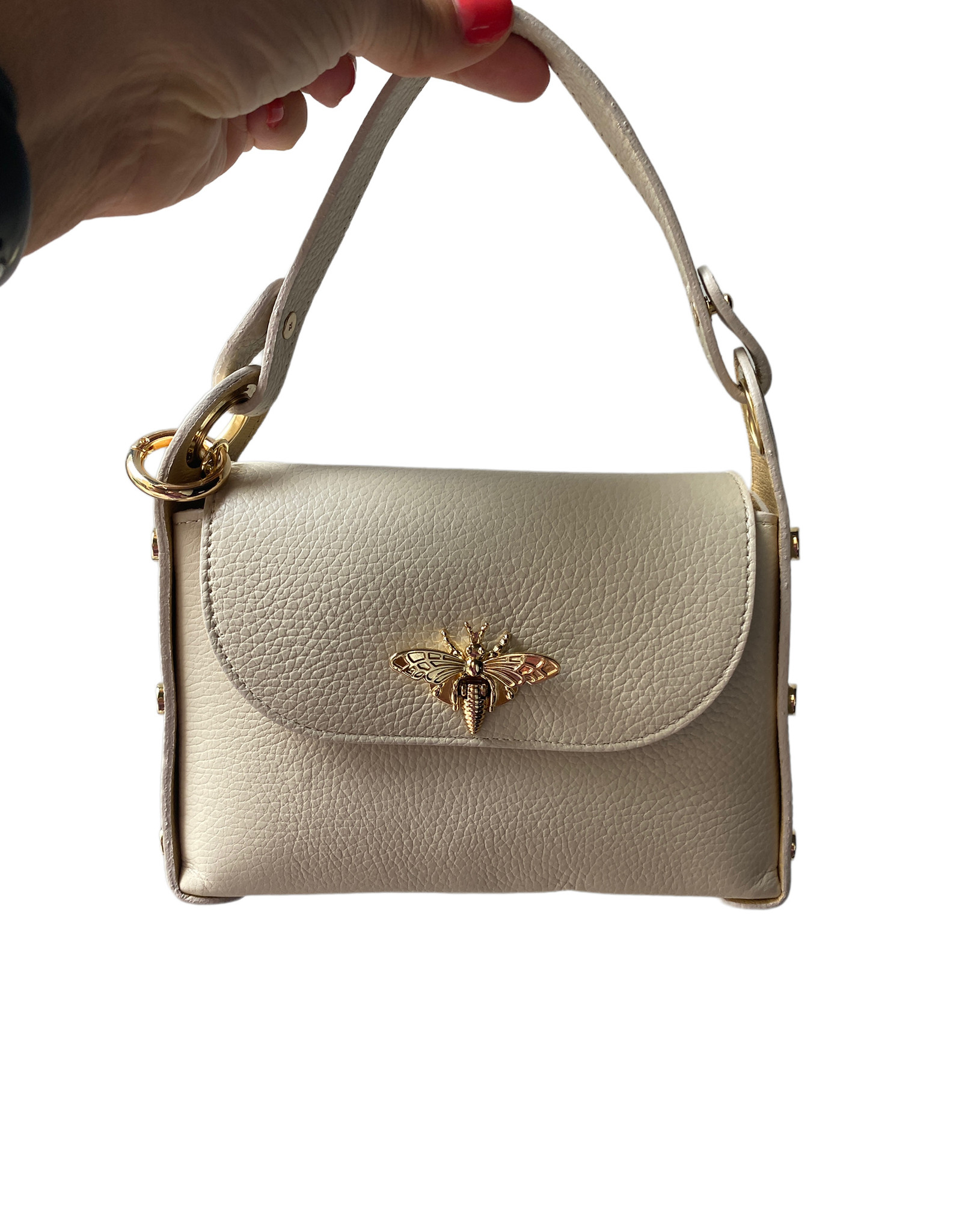 Little small bag with studs at the side en butterfly as buttom in front.  With handle en long remouvable chain shoulderbelt