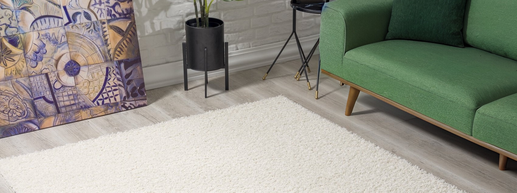 Welk vloerkleed bij groene bank?