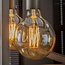 WoonStijl Lichtbron LED filament bol Ø12 5 - E27 6W 2100K 450lm dimbaar / Amberkleurig glas