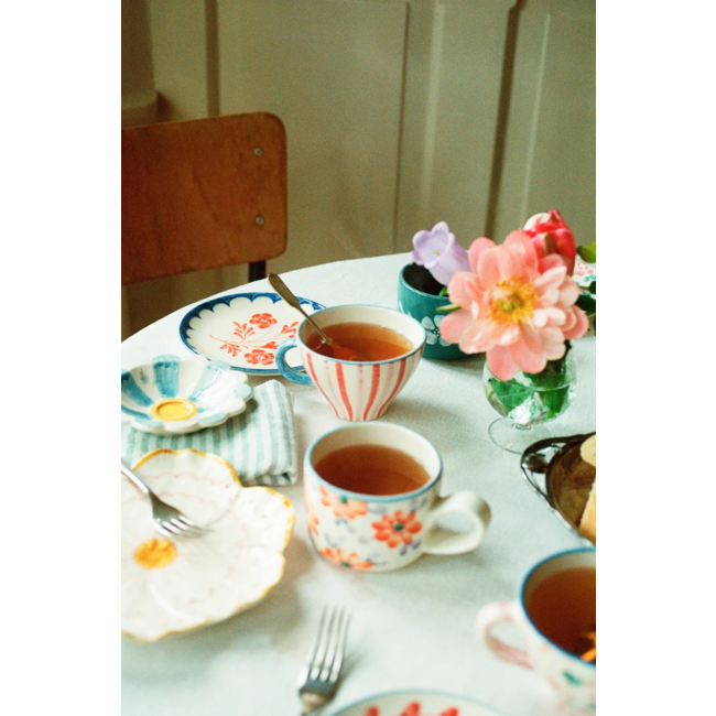 Ceramic tea cup with hand painted stripes