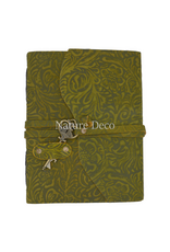. Green leather notebook with a key