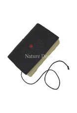 . Colored leather notebook with a stone