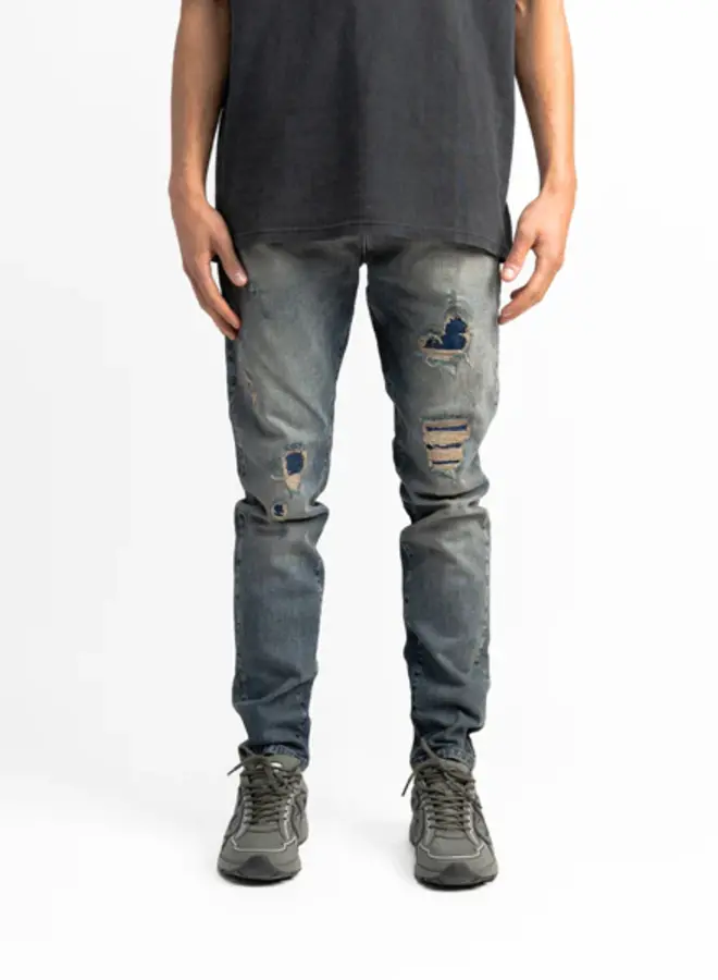 Destroyed repaired jeans sand