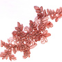 Spitzenapplikation in Alt-Rosa