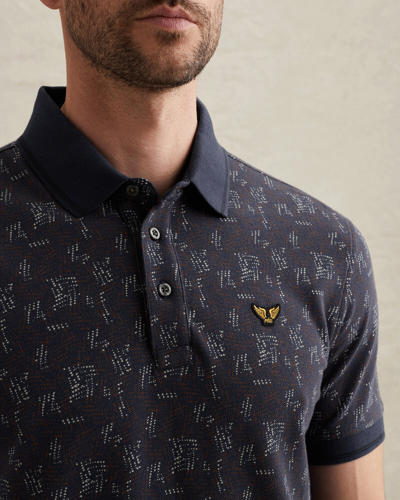 Polo avec imprimé intégral et col en maille côtelée bleu Polo avec imprimé intégral et col en maille côtelée bleu