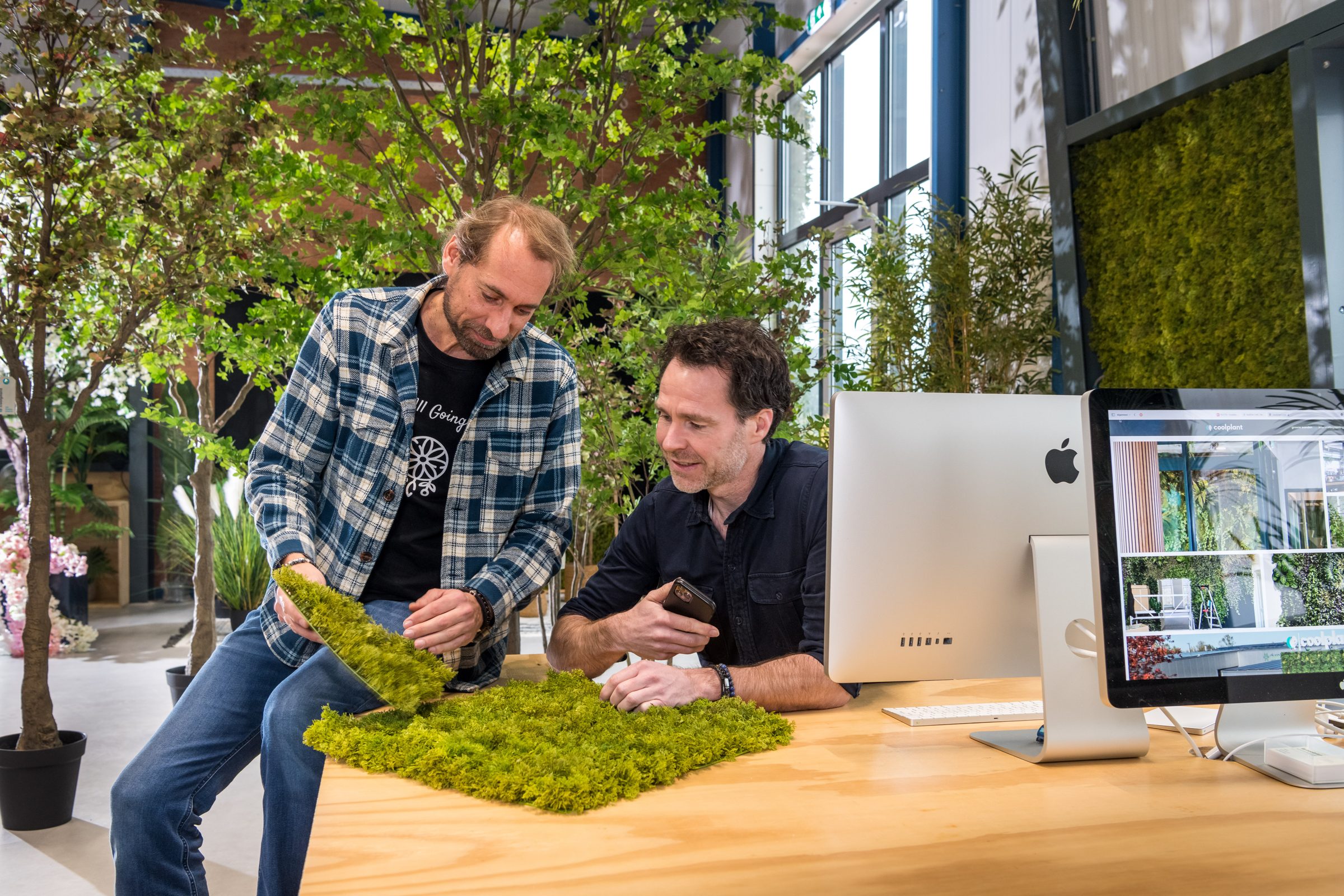 The Coolplant team selecting artificial moss for a moss wall
