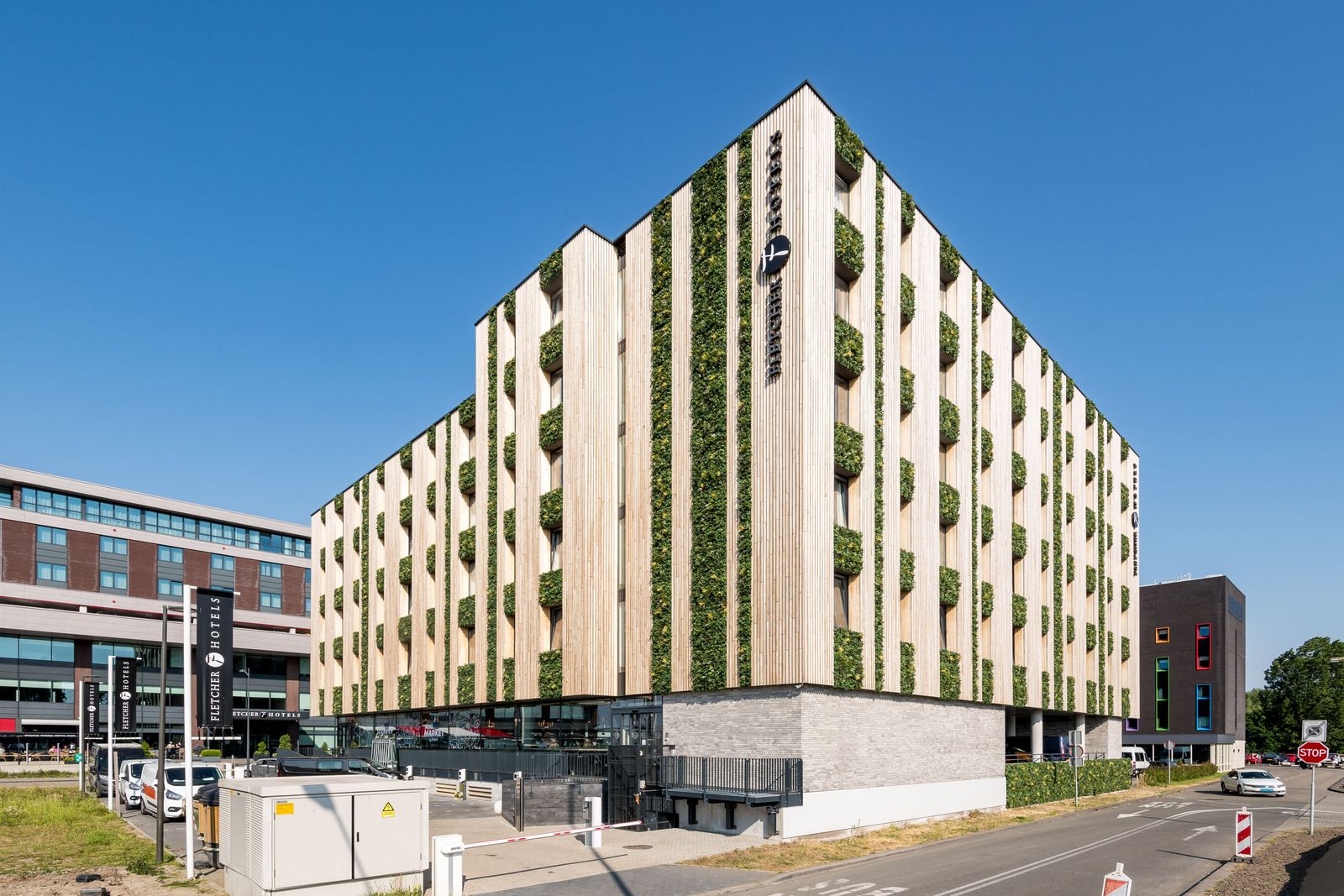 The green façade of the Fletcher Hotel near Rotterdam The Hague Airport
