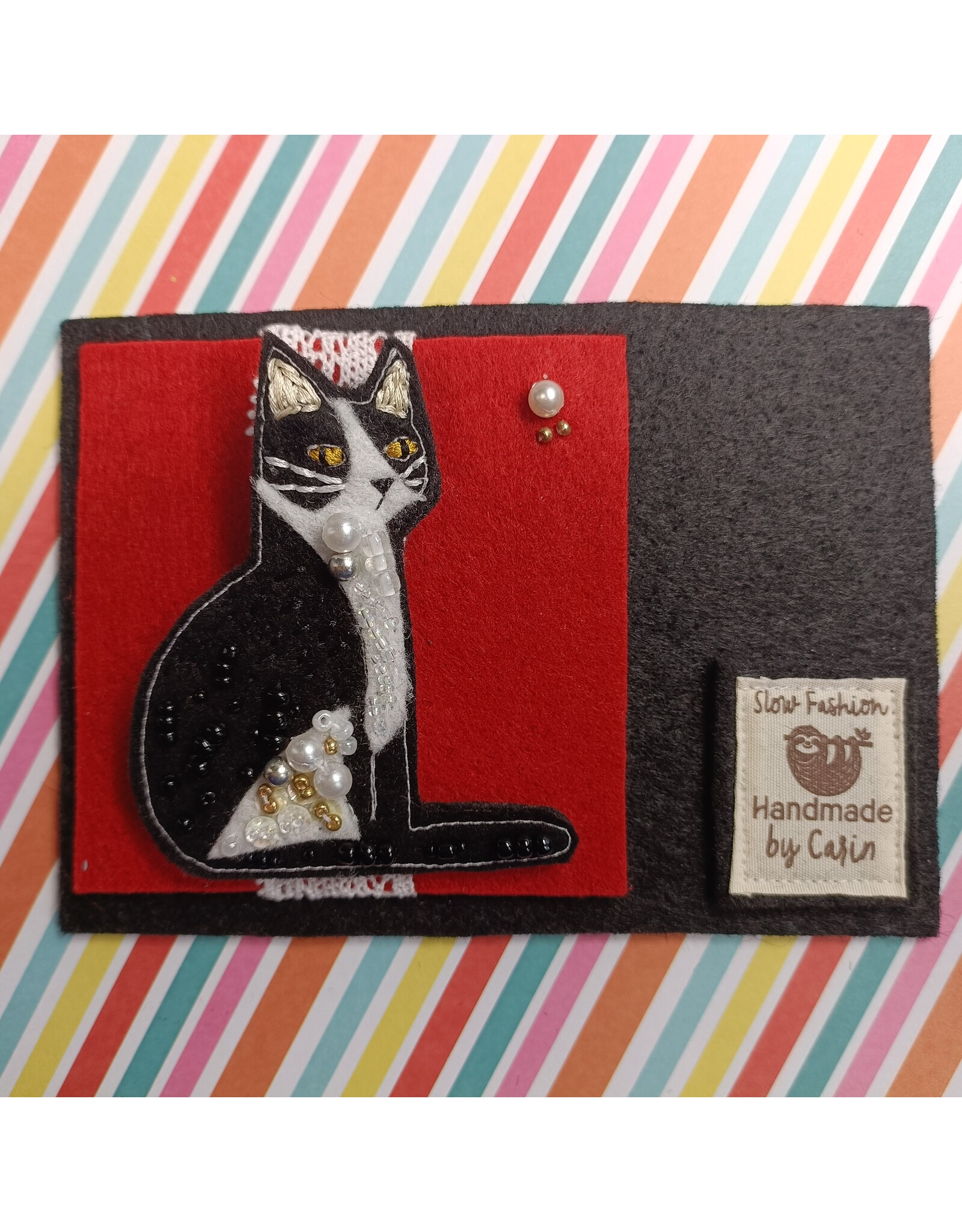 Broche Kat