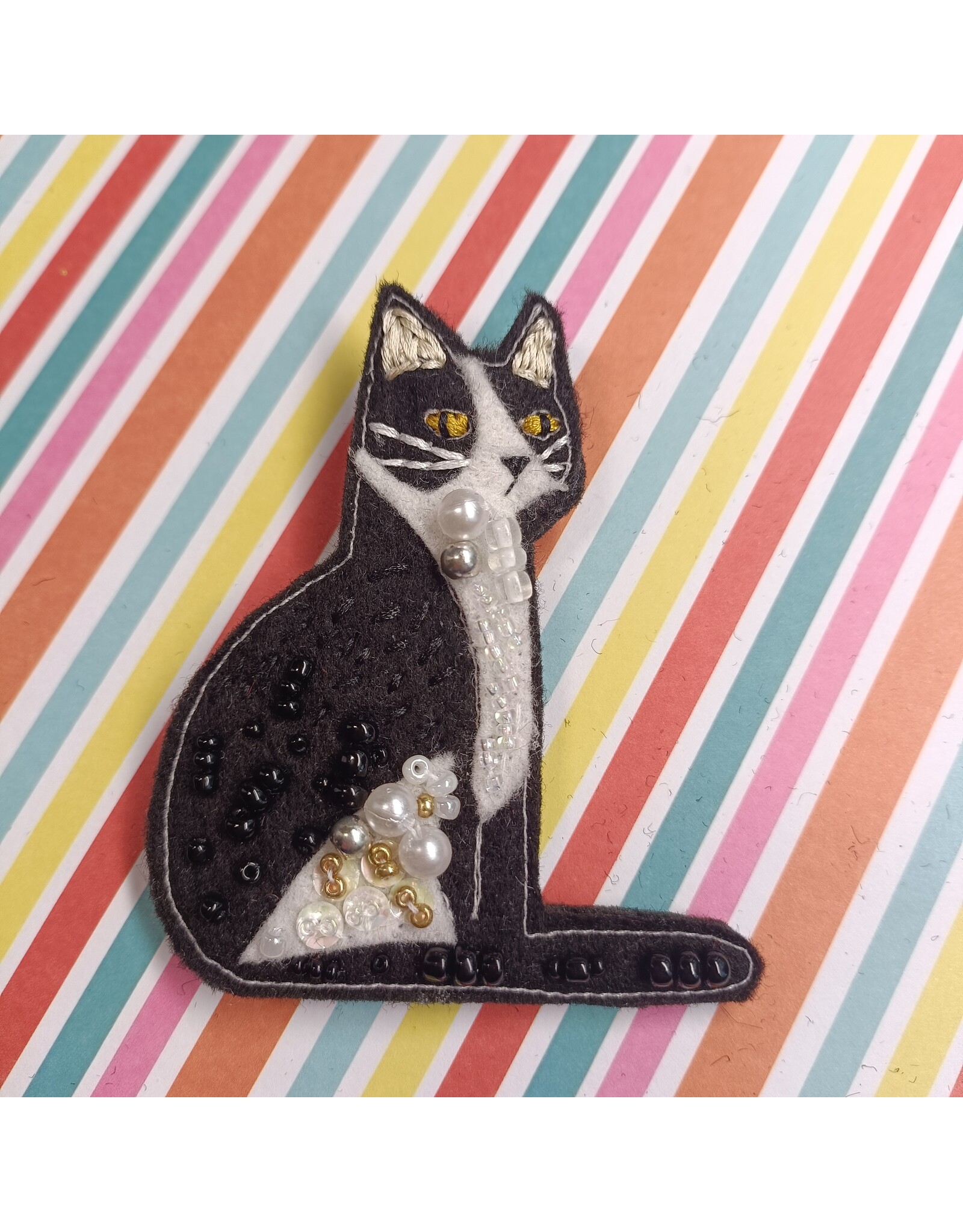 Broche Kat