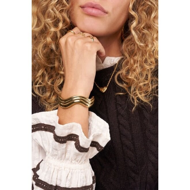 Chunky bangle met swirl goudkleurig