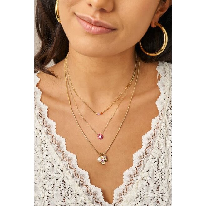 Botanical ketting met bloem en roze strass steen