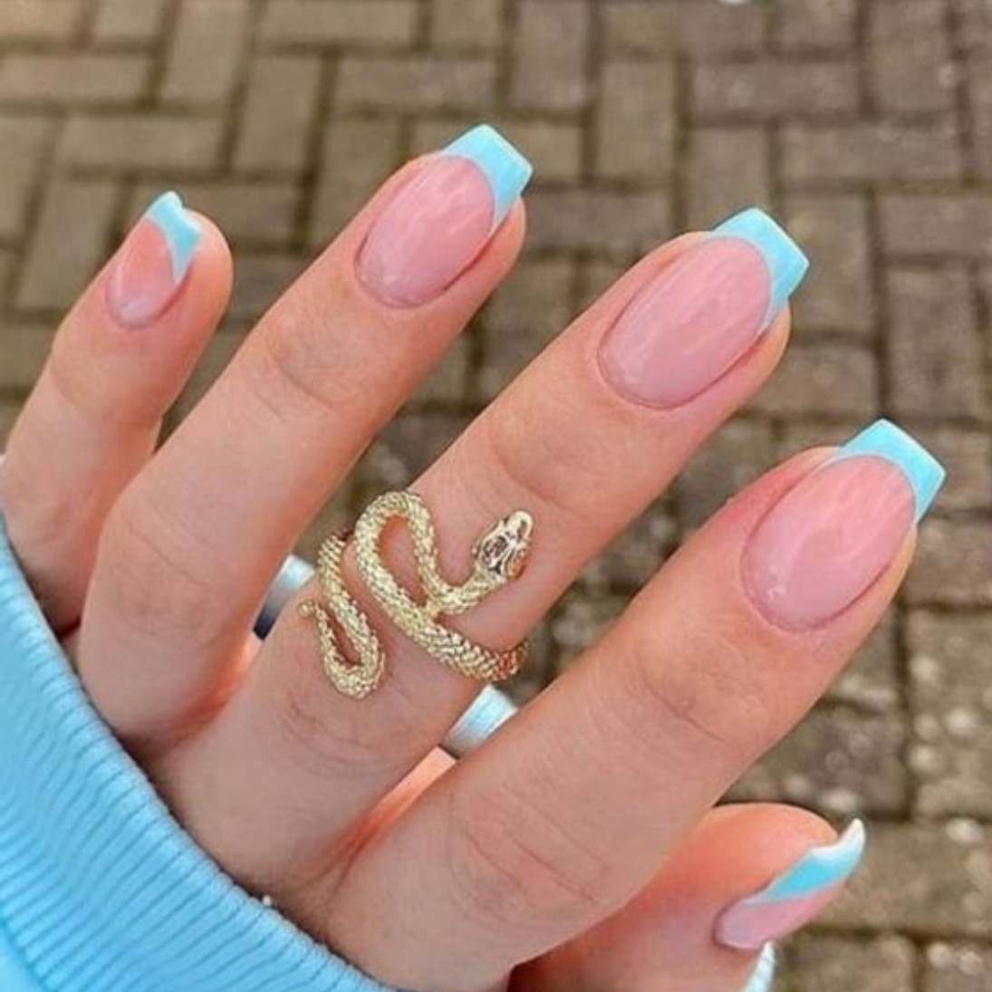 Pastel French Manicure with a soft blue tip, embodying spring vibes