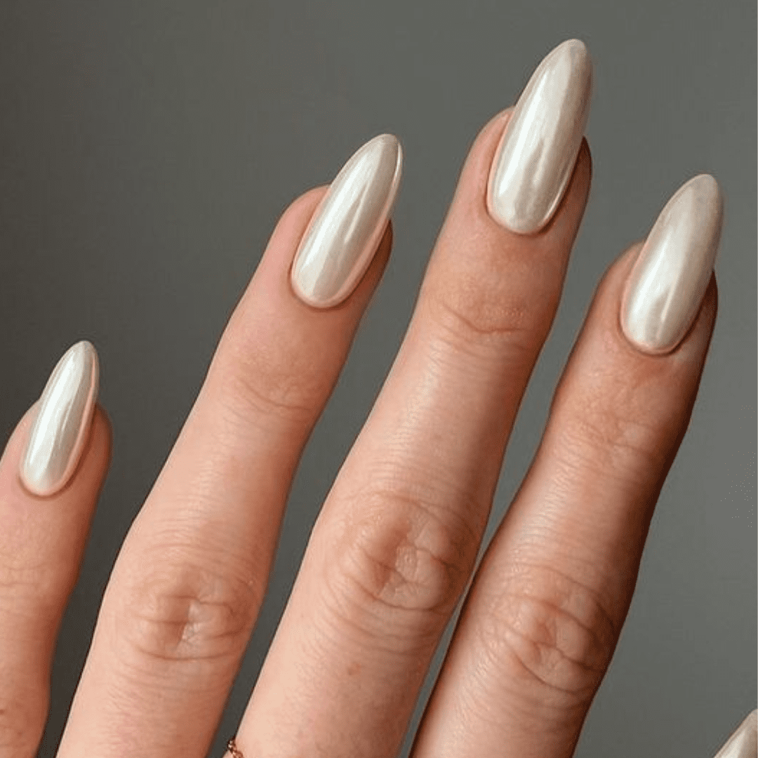 Vanilla Chrome Nails, presenting a soft metallic sheen for an elegant finish.