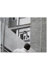 Maurice Hogenboom - Female streaker poses in broken window frame of Amsterdam apartment