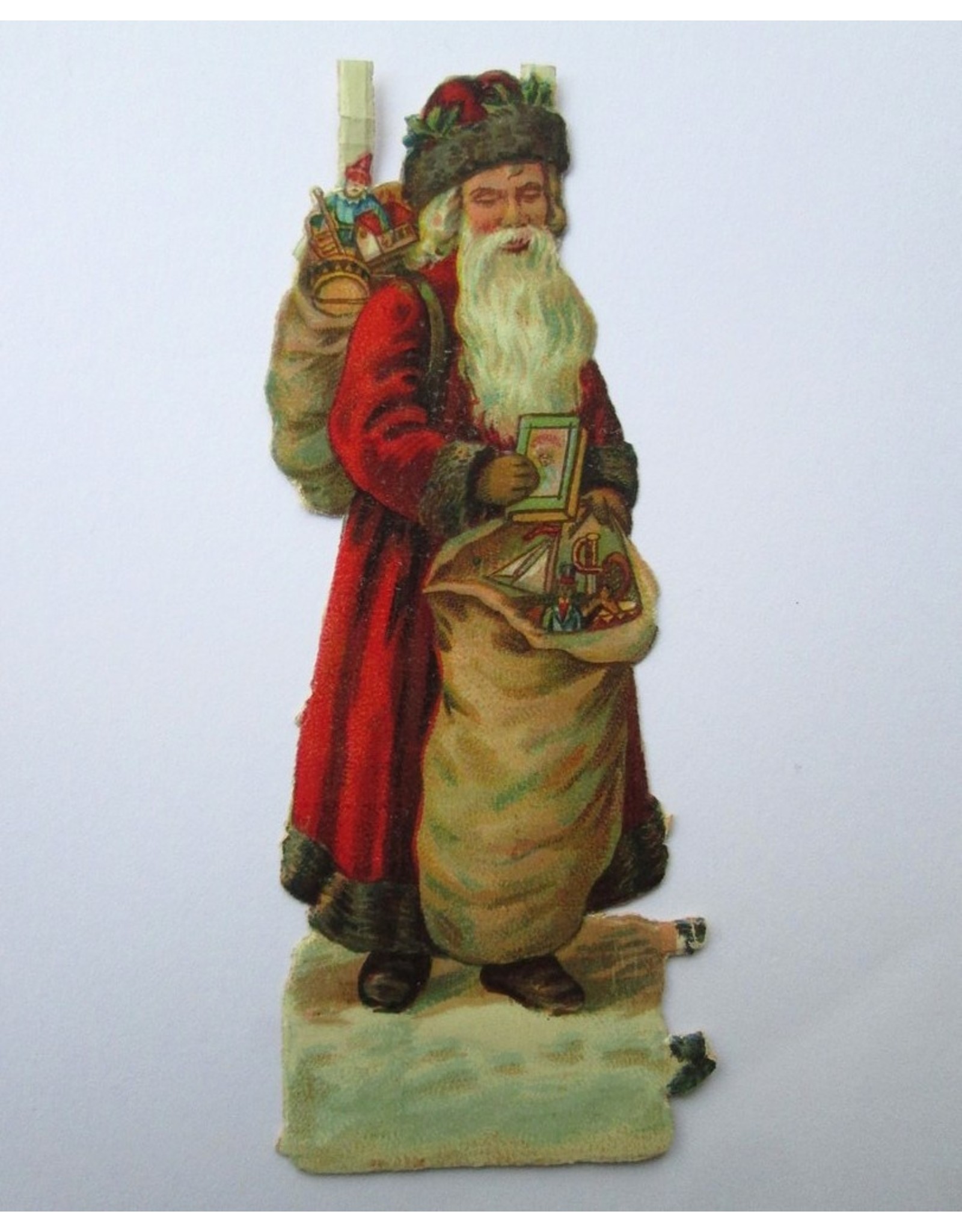 [Christmas]: [Album pictures featuring two Santa Claus figures in chromolithography]