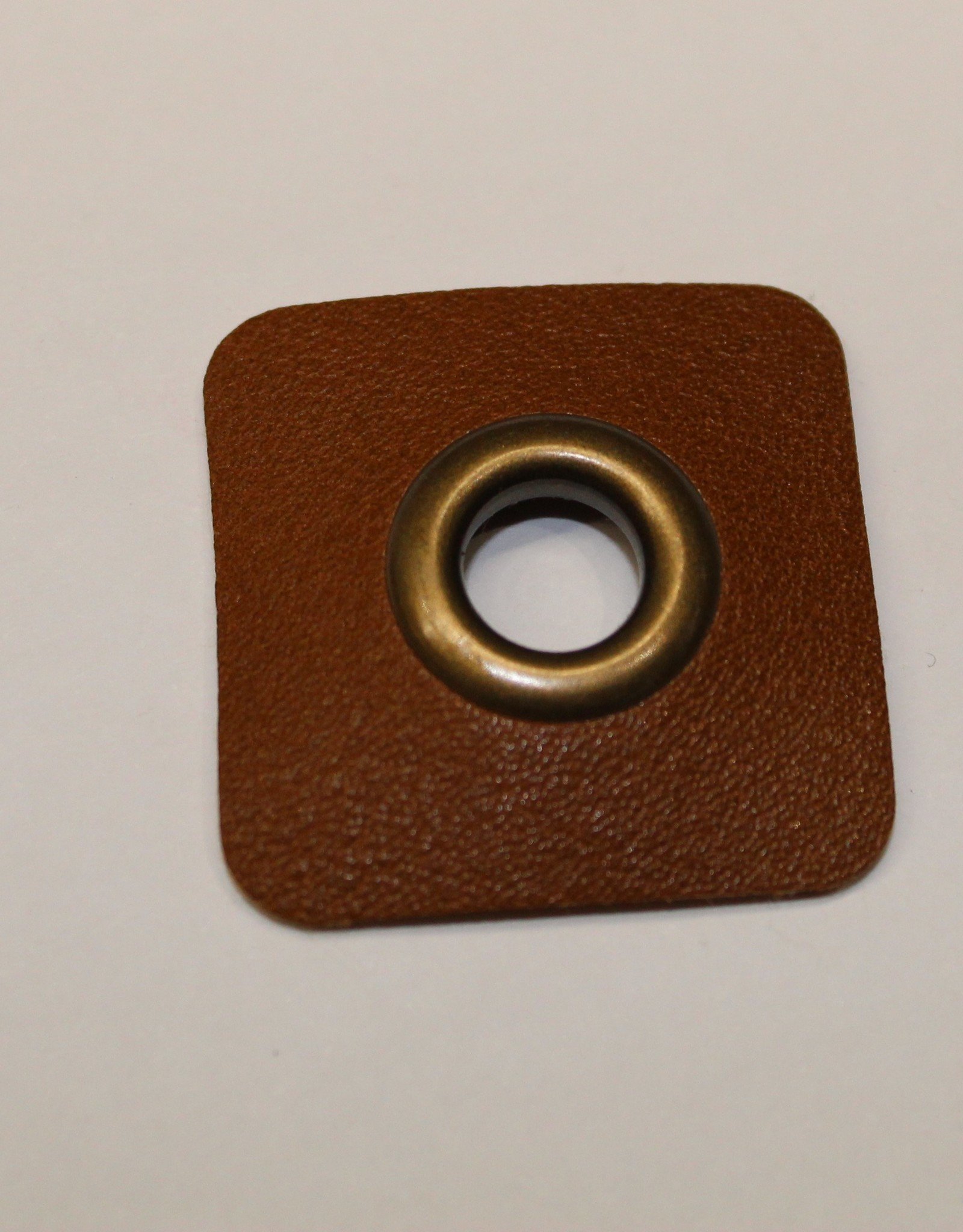 Nestelring met cognac leder