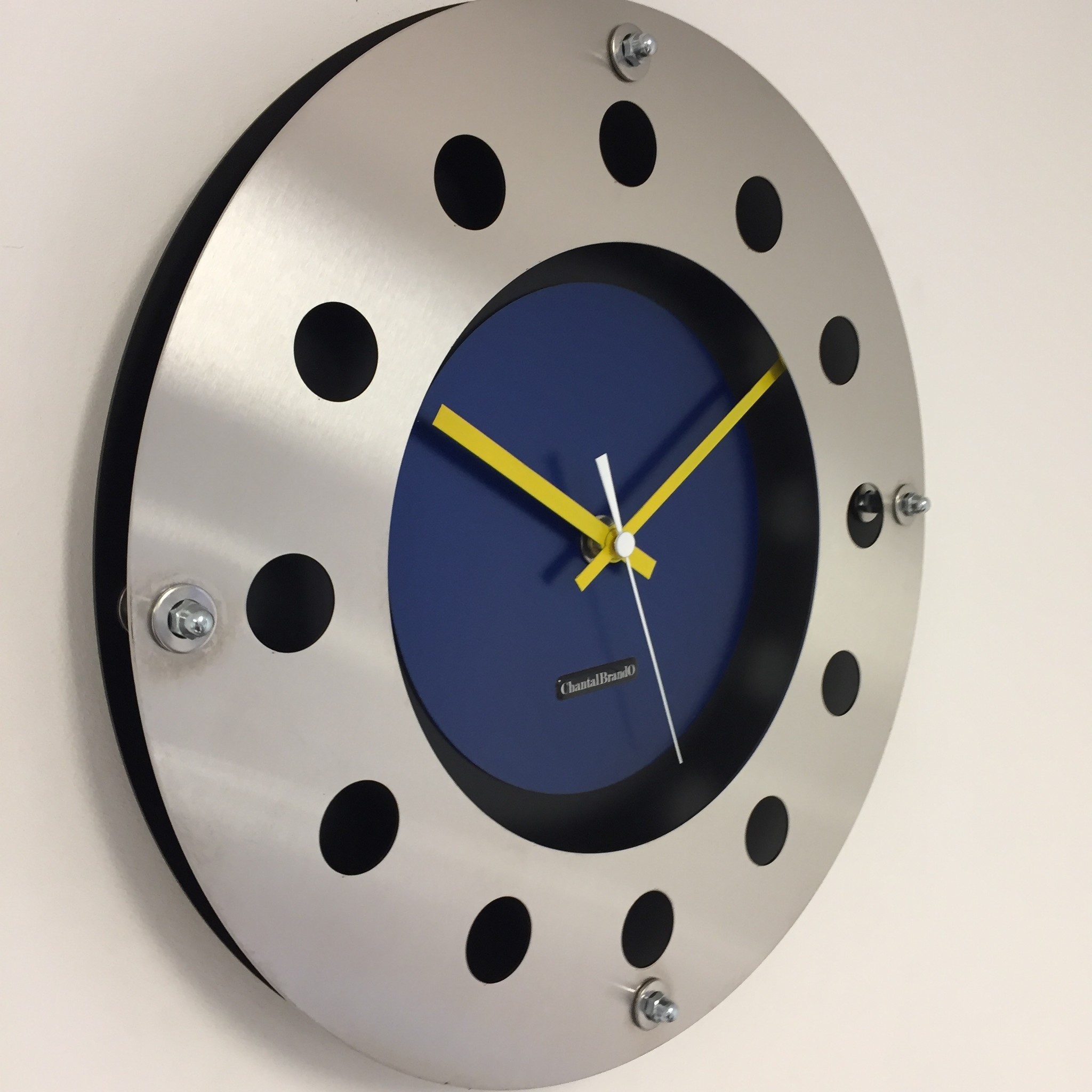 ChantalBrandO Design - wall clock mecanica full black with blue color small indoor circle yellow white pointer modern Dutch design handmade 40 cm