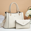 HANDTAS MET DRUKKNOP BEIGE