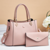 HANDTAS MET DRUKKNOP ROZE