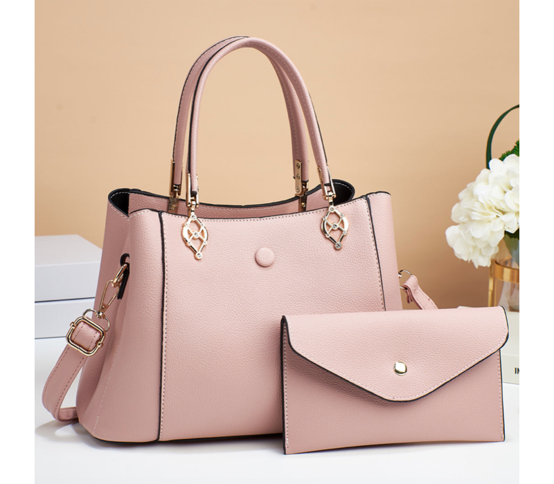 HANDTAS MET DRUKKNOP ROZE