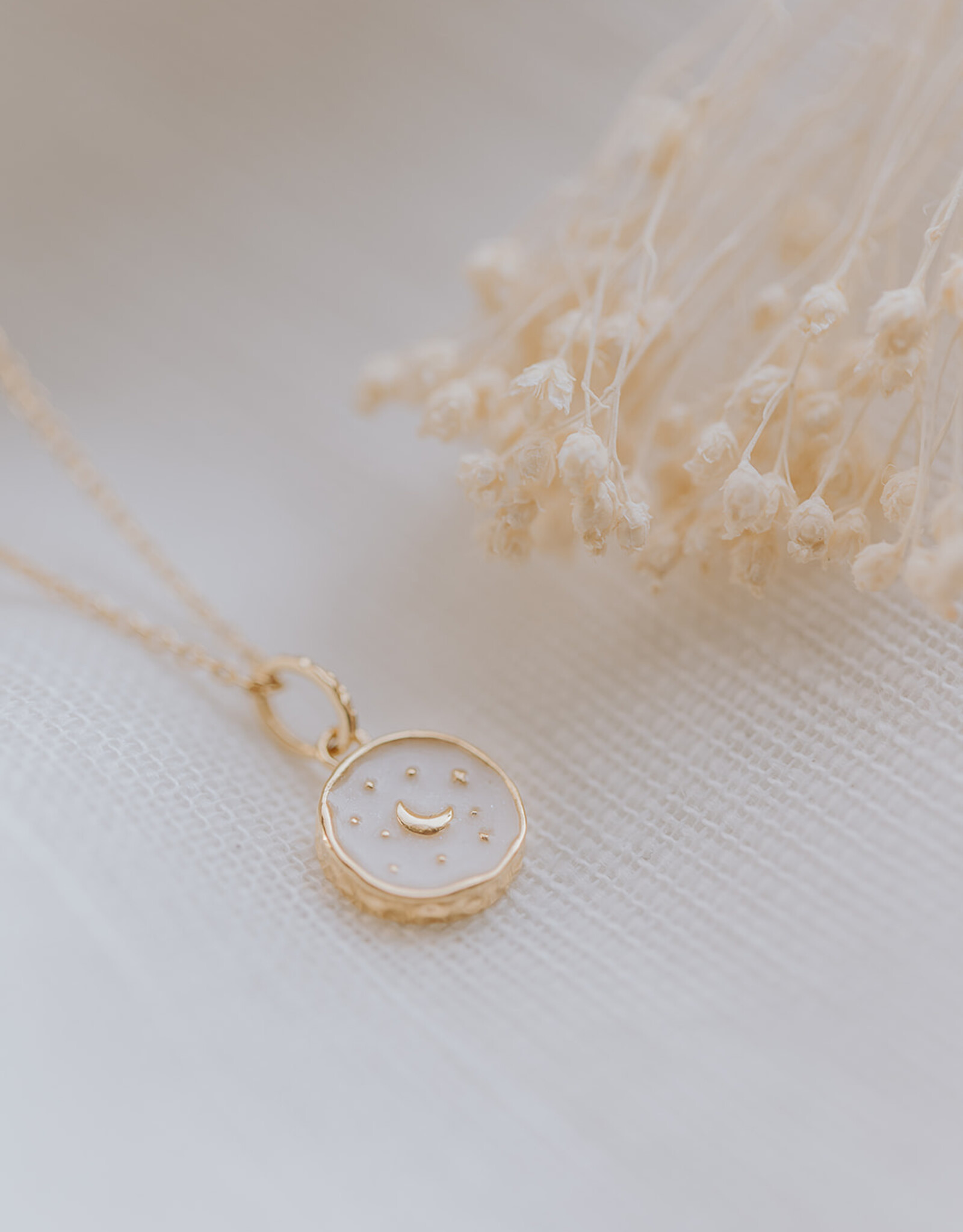 Breastmilk necklace with moon and stars