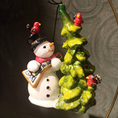 Snowman with crooked tree