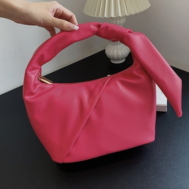 Rosa Handtasche in Lederoptik mit Plissee-Detail