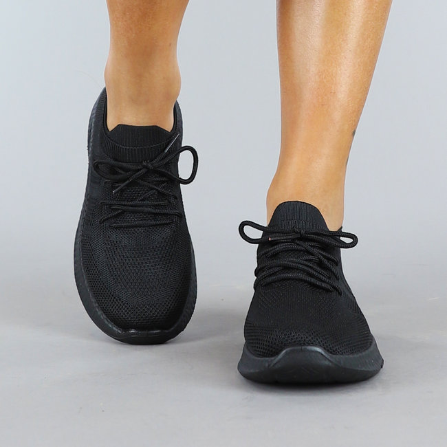 Schwarze Slip On Sneakers mit Sockenmodell